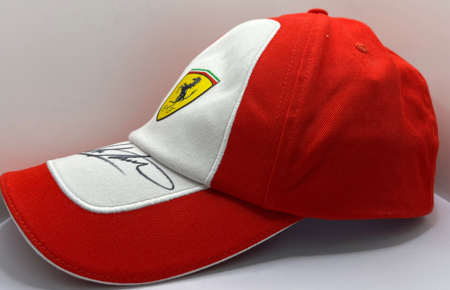 John Surtees - British Racing & Motorcycle Driver Signed Red & White Ferrari F1 Cap with COA