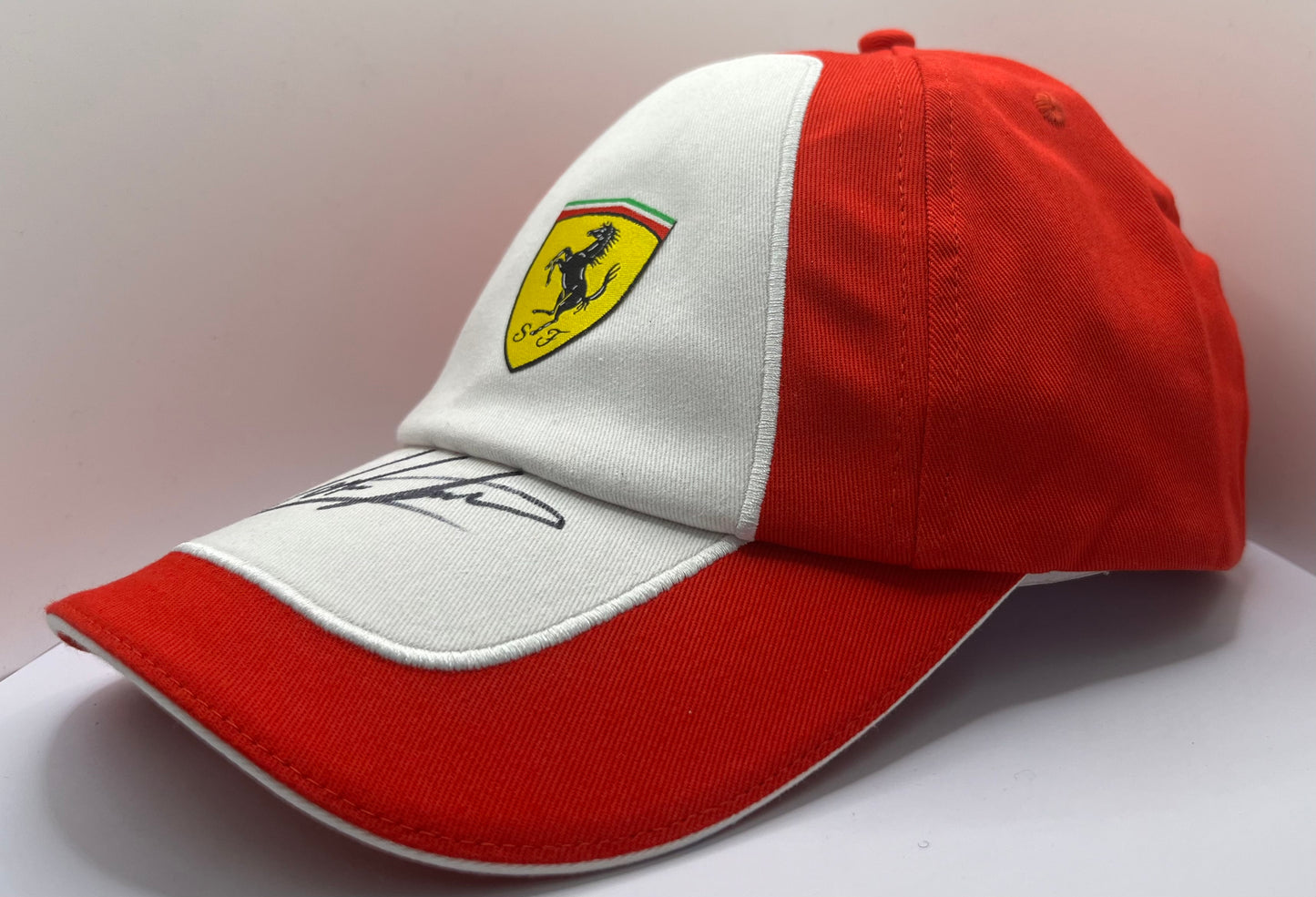 John Surtees - British Racing & Motorcycle Driver Signed Red & White Ferrari F1 Cap with COA